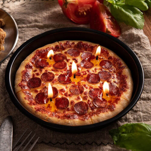 A close look of the lighted pizza candle