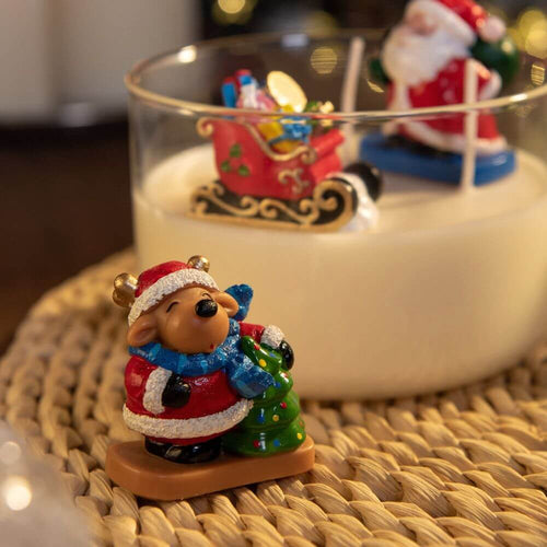 Reindeer Holding a Christmas Tree in The Christmas Candle